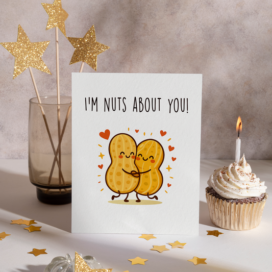 Adorable peanut couple hugging in a cute cartoon style with warm colors and heart details. This fun love card features a sweet food pun ideal for girlfriends, partners, or best friends.