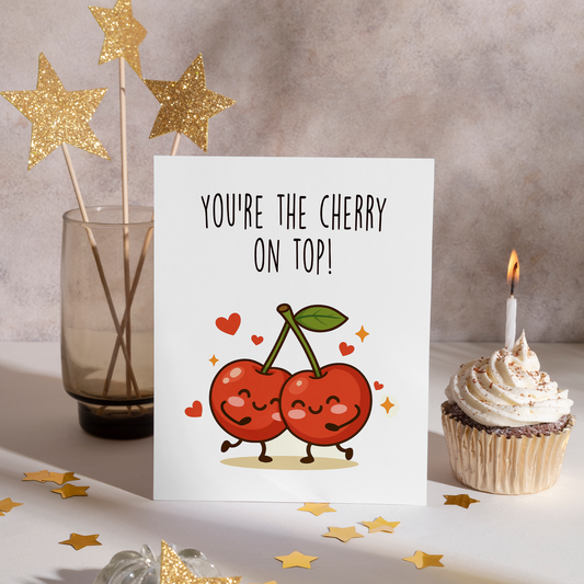 Adorable illustrated card showing two happy red cherries connected by stems and surrounded by hearts and sparkles. The cherry on top phrase delivers a fun, affectionate message with a charming and joyful tone.
