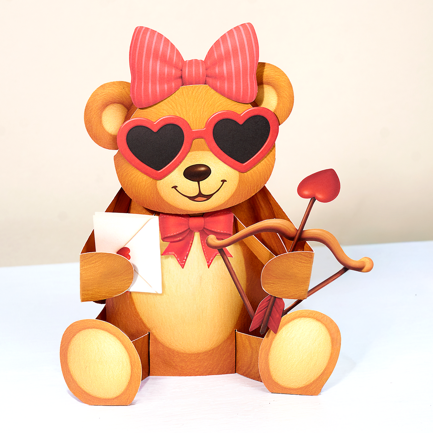 Teddy bear with heart-shaped sunglasses and a bow, holding a bow and arrow, on a white background.