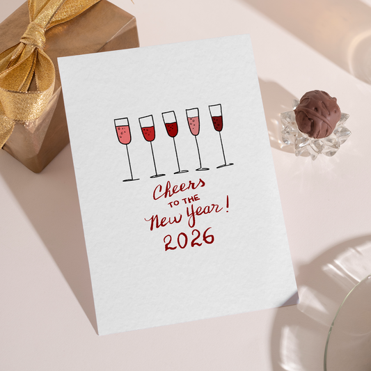 Minimalist 2026 New Year card featuring a lineup of champagne flutes in soft red tones. The design represents celebration, optimism, and welcoming the new year with style.