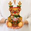 Decorative reindeer figure with glasses, Santa, and snowman on a white background