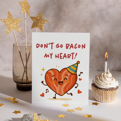 Adorable food-themed card showing a cartoon bacon heart dancing with musical notes and hearts. The cheerful design makes it perfect for Valentine’s Day or romantic occasions.