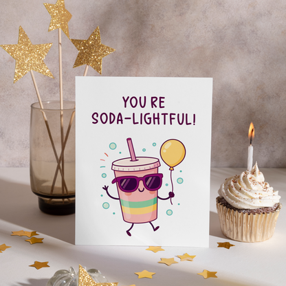 Cute illustrated birthday card featuring a colorful soda drink character with sunglasses and floating bubbles. The cheerful artwork and fizzy theme make this card feel lighthearted and joyful.