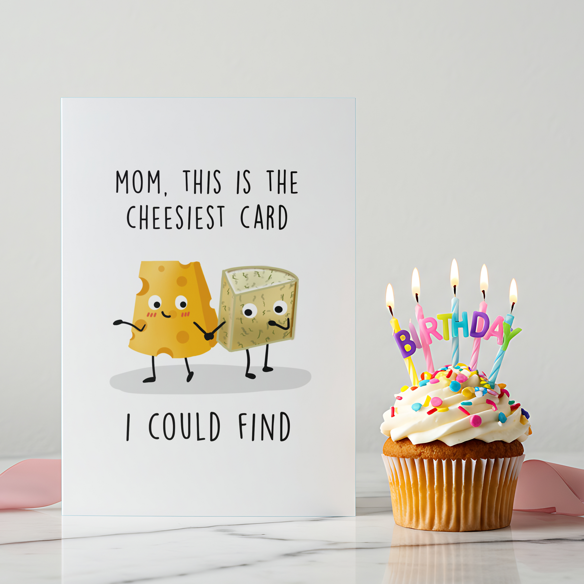 Cute illustrated cheese characters on a humorous greeting card designed for moms. The card combines food humor with a warm, loving tone.