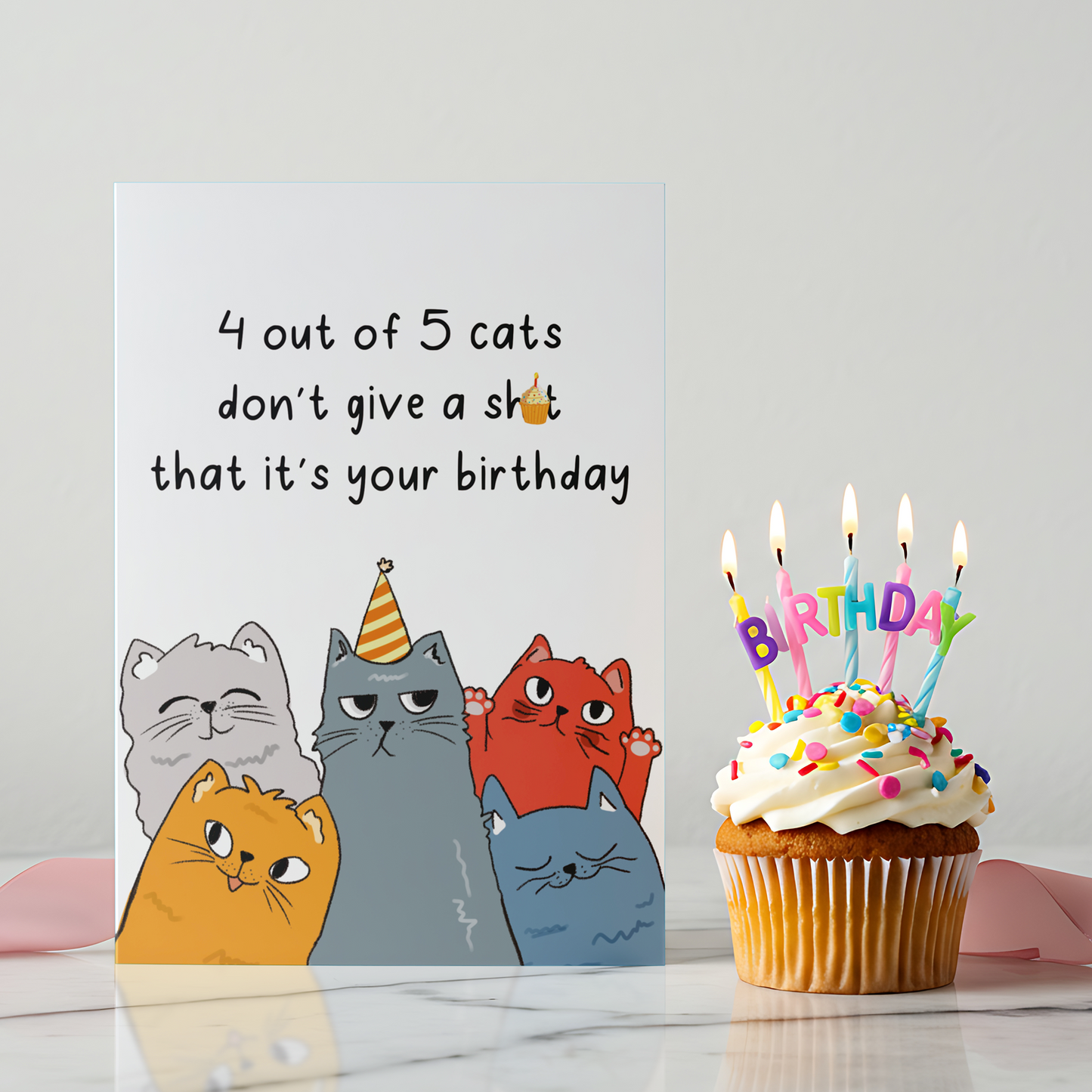 Funny birthday card featuring five illustrated cats with unimpressed expressions on a white background. The design uses sarcastic humor to poke fun at birthdays in a playful way.