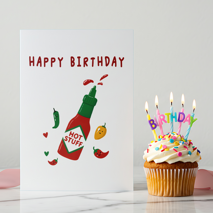 Cute hot sauce birthday card showing cartoon chili peppers and heart accents. The illustration style is simple, colorful, and designed to feel fun and lighthearted.