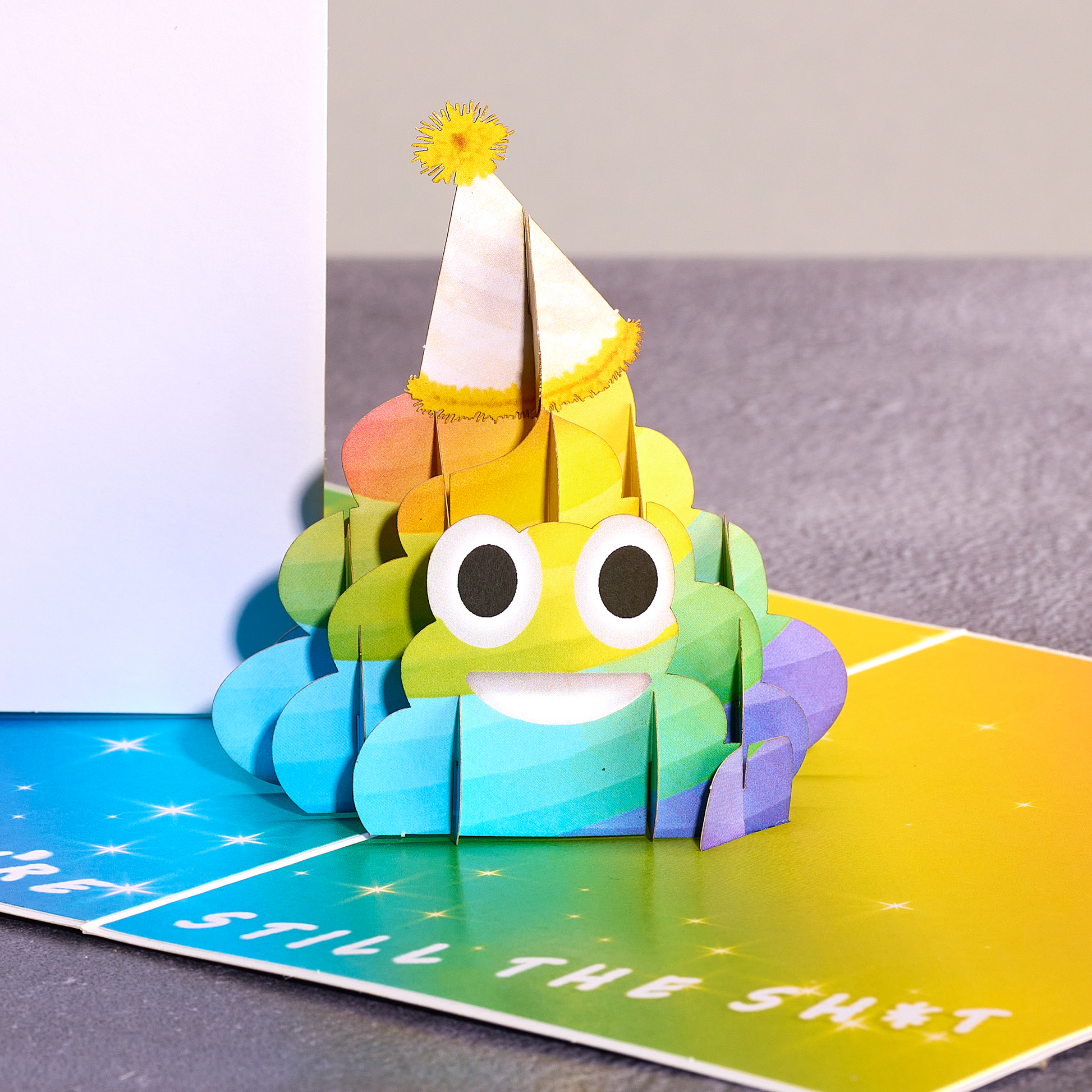 A hilarious pop-up card featuring a rainbow poop emoji to brighten up someone's birthday! Guaranteed to bring laughter!