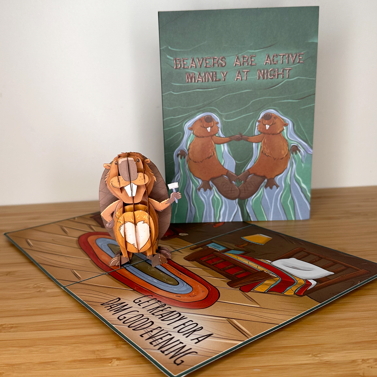 Funny pop-up anniversary card: Beaver pop up with a shaver, showcasing a shaved heart on its belly.