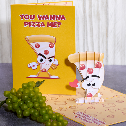 Looking for a fun Valentine's Day card? Check out this pizza pop-up card! It's a hilarious way to show your love for pizza, with a slice holding out its heart and the text Because I wanna give you a pizza my heart. Ideal for pizza lovers!