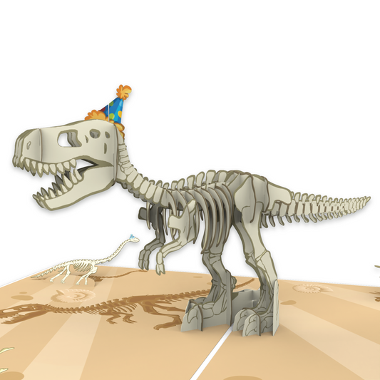 A pop-up card featuring a T-Rex skeleton wearing a blue party hat with orange pom-poms, standing on a beige background with fossil prints. A smaller dinosaur skeleton in a blue party hat is visible in the background.