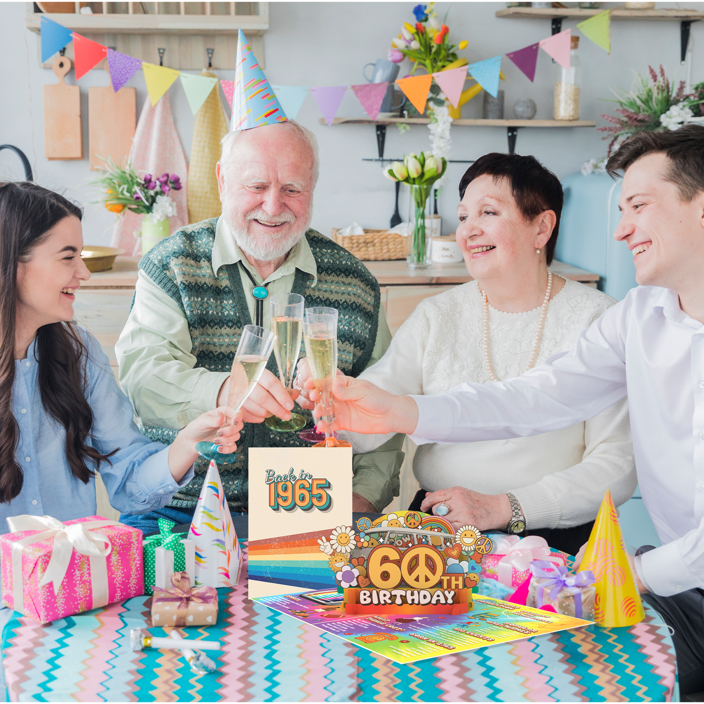 Family celebrating a 60th birthday with drinks and presents in a decorated room.