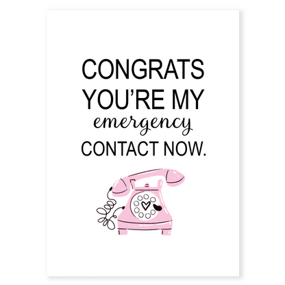 Funny relationship greeting card with a retro pink phone illustration and humorous text announcing someone as your emergency contact. The simple layout and soft pink accent create a lighthearted, romantic vibe ideal for partners, spouses, or long-term couples.
