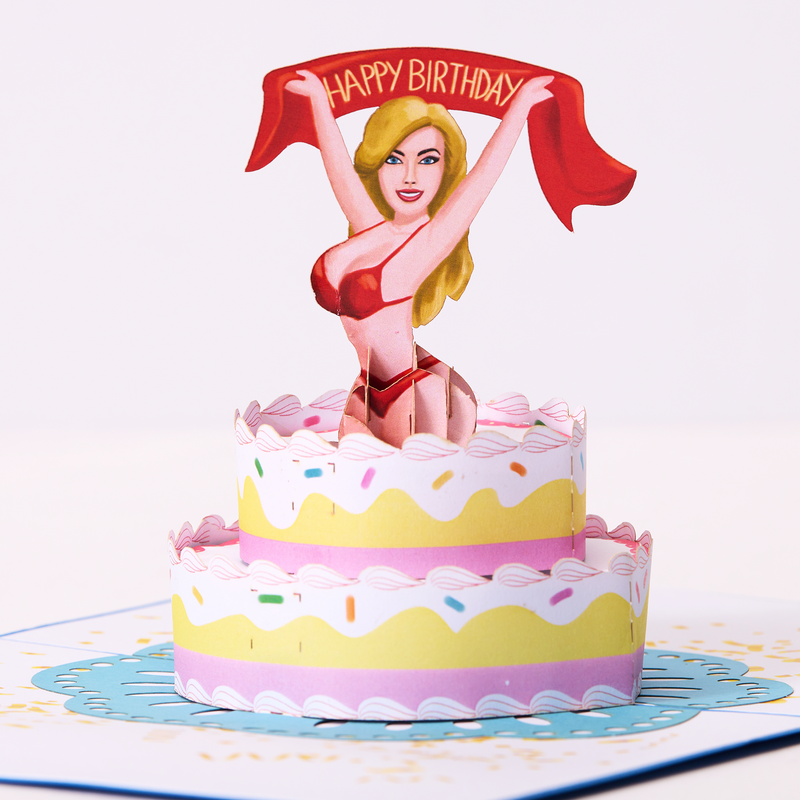 A pop-up card showcasing a gorgeous woman gracefully perched on a cake, radiating beauty and joy.
