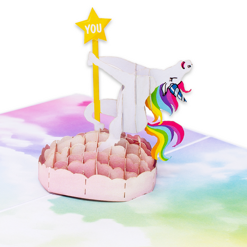 A pop-up card featuring a unicorn on a rainbow background, adding a touch of magic and color to your day!