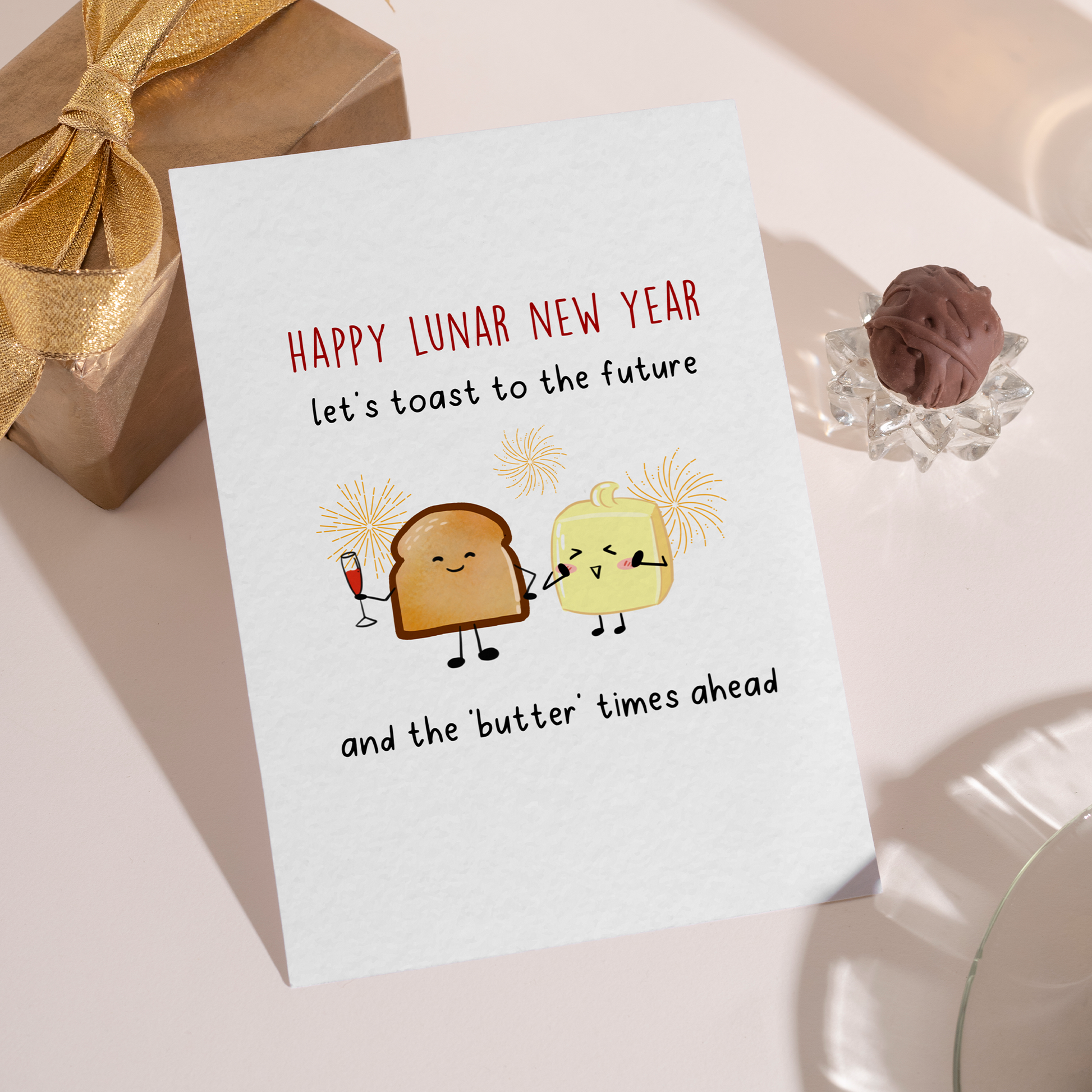 Cute illustrated toast and butter characters celebrating the Lunar New Year with drinks and fireworks. The design uses warm colors and humor to suggest better times ahead.
