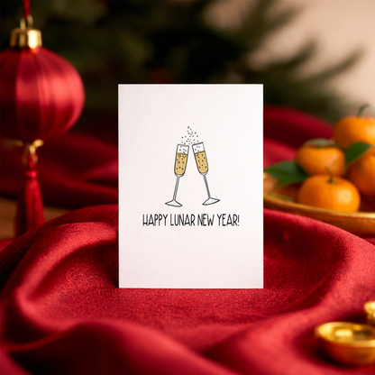 Elegant Lunar New Year card with two sparkling champagne glasses touching at the top. The artwork represents celebration, optimism, and a lucky start to the year.