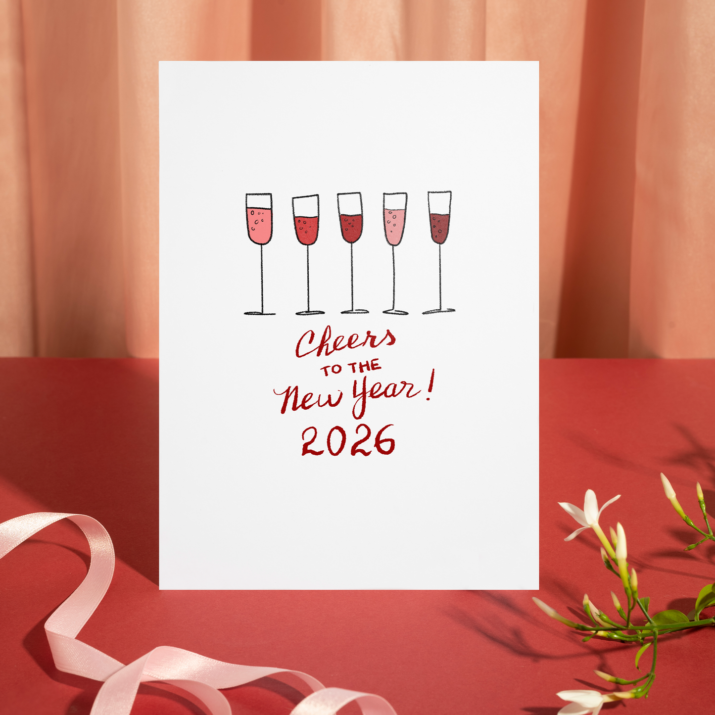 Elegant New Year card displaying sparkling champagne glasses above a celebratory 2026 message. The illustration reflects warmth, celebration, and a positive start to the year.