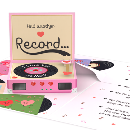 A 3D pop-up card designed as a pink record player, featuring a vinyl theme with love notes, hearts, and musical details. The inside includes romantic messages, tiny illustrated records, and playful heart decorations, creating a nostalgic and heartfelt design.