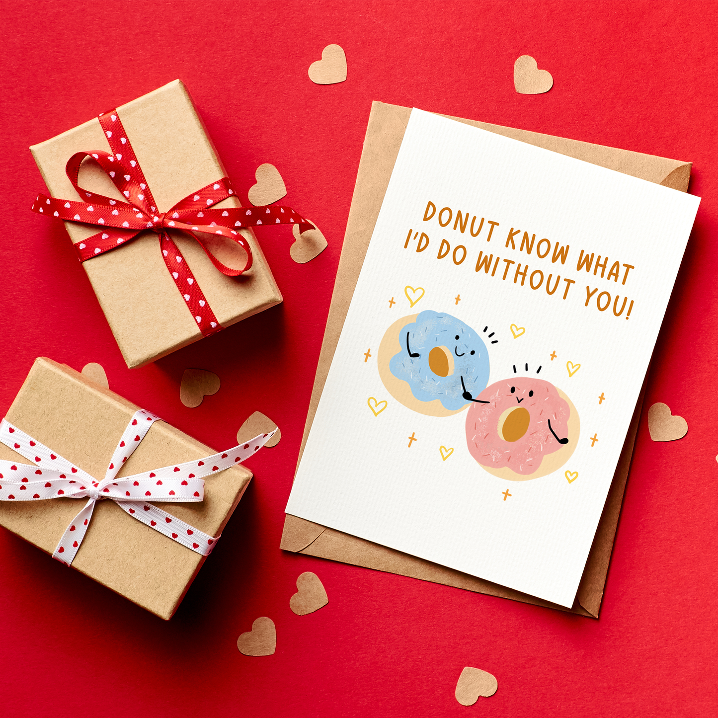 Gifts with ribbons and a card on a red background with heart decorations
