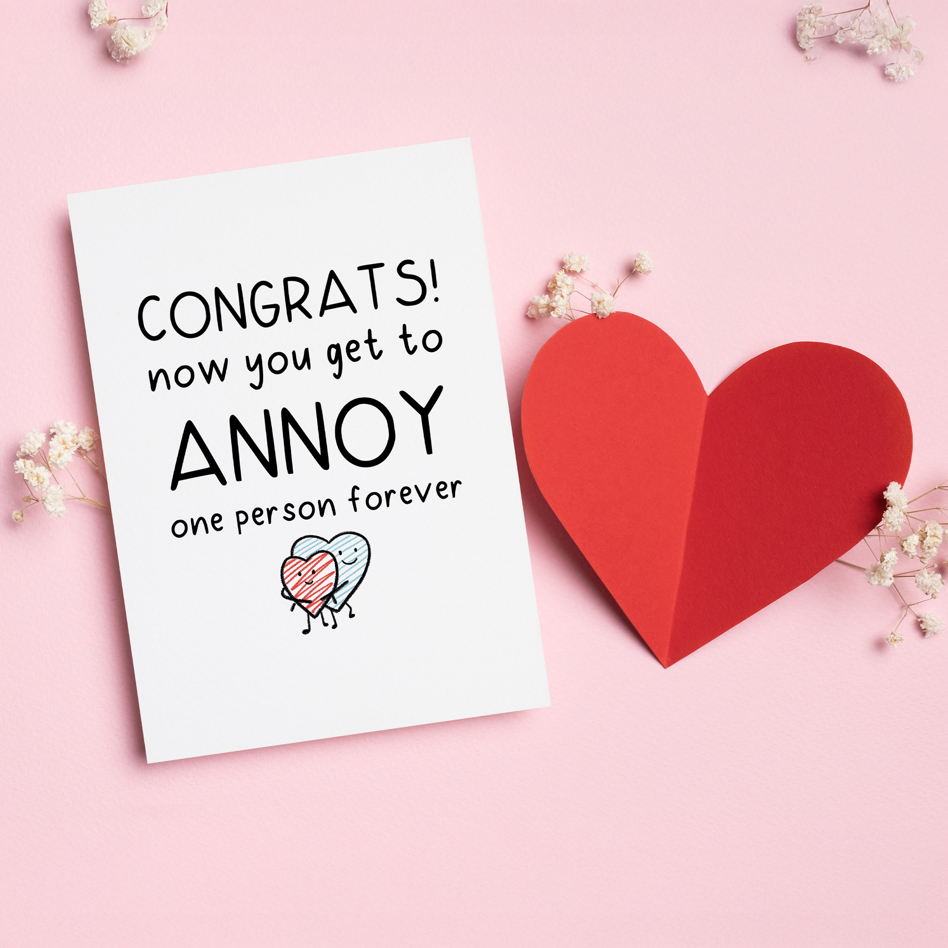Congrats, You’re Taken is a funny love card for couples who know that love means choosing the same person and annoying them forever.&nbsp;With a playful illustration and cheeky message, this card is perfect for Valentine’s Day, engagements, anniversaries, or just reminding your partner that they’re officially stuck with you.