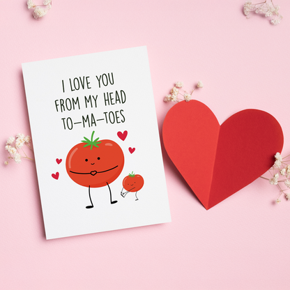 Card with cartoon tomatoes and text 'I love you from my head to-ma-toes' on a pink background with a heart and flowers.