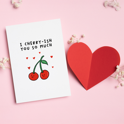 I Cherry-ish You So Much” is a sweet and playful Valentine’s card featuring an adorable cherry pair and a fun food pun. Perfect for couples who love cute humor and lighthearted romance, this charming design is a delightful way to say I cherish you without being overly serious.