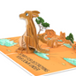 A pop-up card featuring a 3D kangaroo looking sad, set in a desert landscape with trees and rock formations. The text reads, Sorry for destroying your Down Under, adding a humorous touch to the scene.