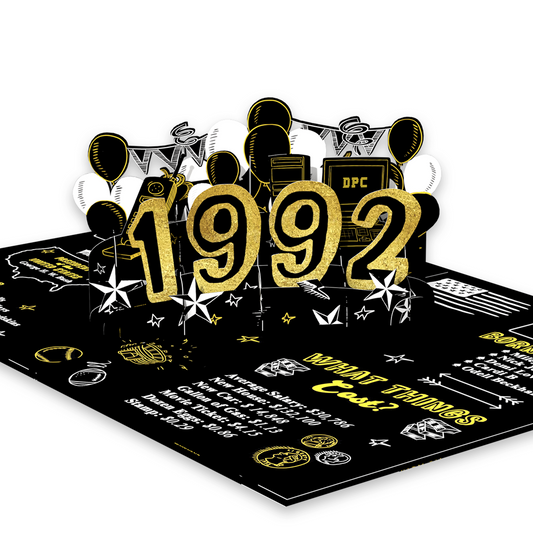 A 3D pop-up card featuring the year '1992' in glittery gold numbers, surrounded by balloons, stars, and retro-themed illustrations on a black background with facts and graphics from 1992
