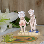 A delightful paper couple, hand in hand, symbolizing love and unity. This image is from a funny Valentine's Day pop-up card, showcasing the journey of love and aging together.