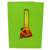A green greeting card with an illustration of a colorful bong in orange and yellow tones, decorated with a cannabis leaf and a small pile of herbs at the base, creating a vibrant and playful design.