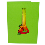 A green greeting card with an illustration of a colorful bong in orange and yellow tones, decorated with a cannabis leaf and a small pile of herbs at the base, creating a vibrant and playful design.